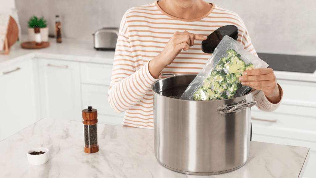 A person holding a bag of vegetables in a pot