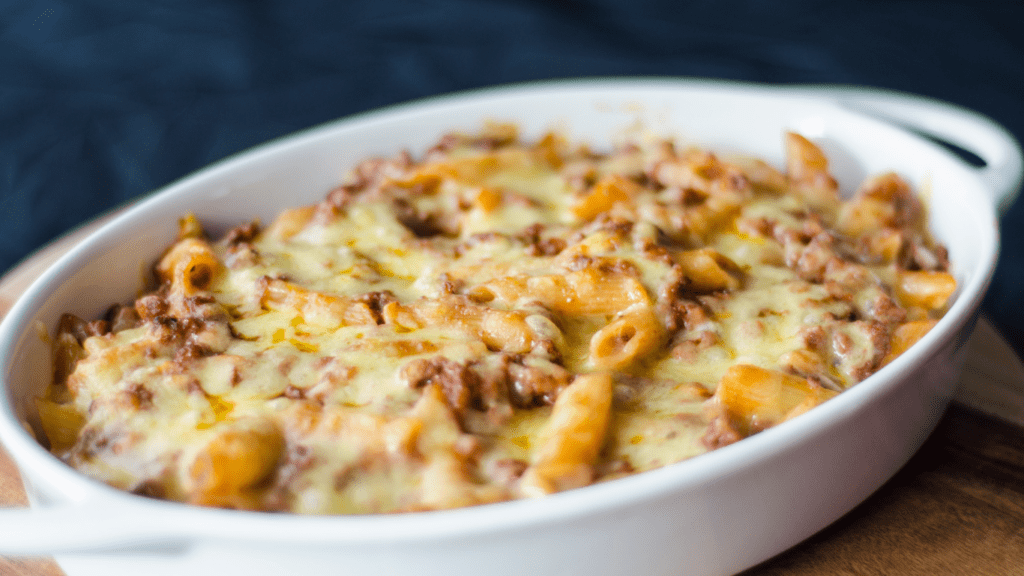 cheesy pasta bake in a white