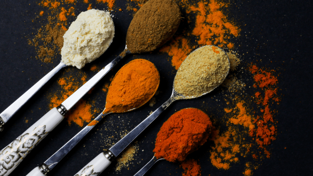 spoons with different types of spices on them