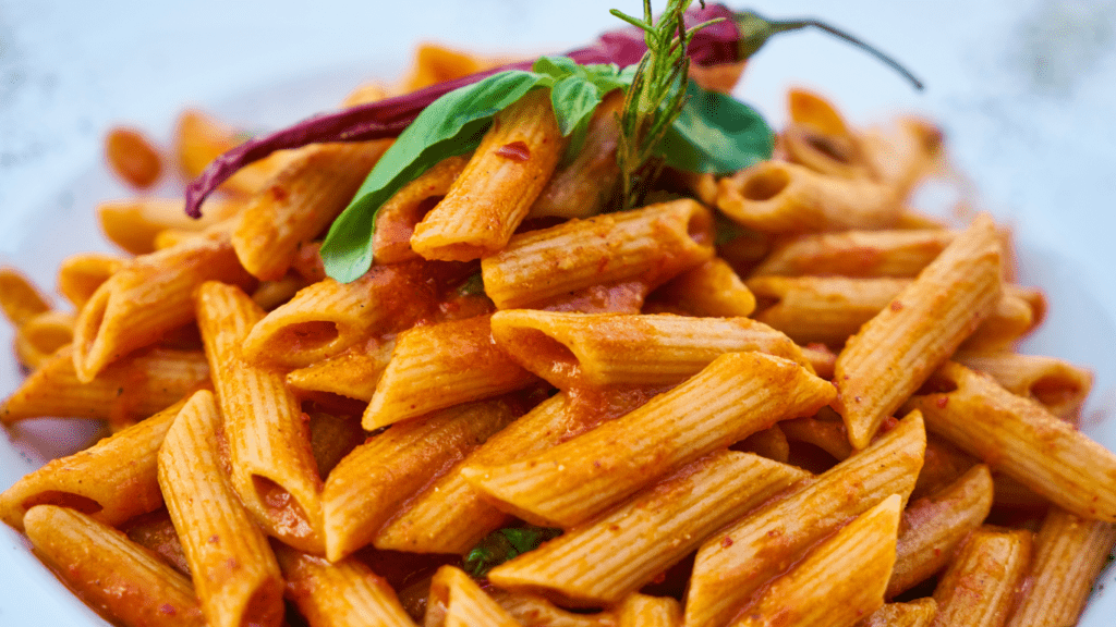 pasta with tomato sauce on a white plate