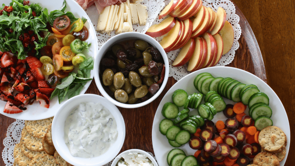 a platter of appetizers on a wooden table