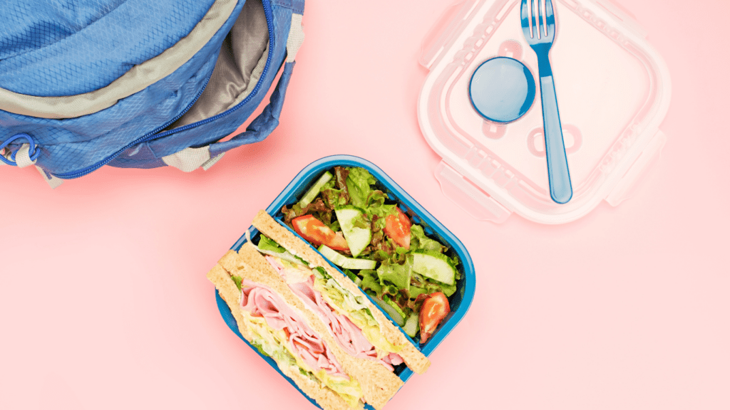 a lunch box with meat and vegetables