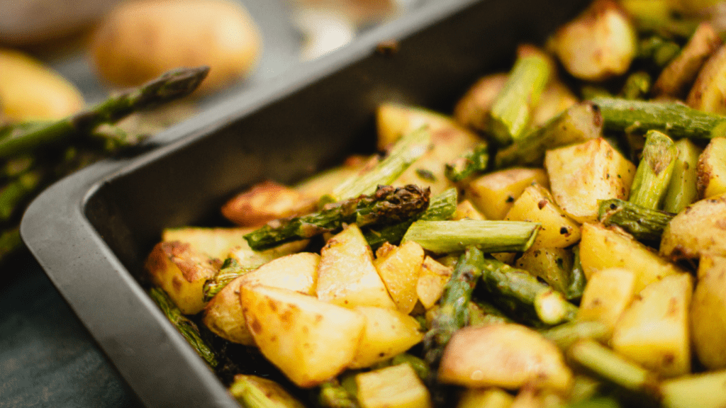 a pan filled with potatoes and vegetables