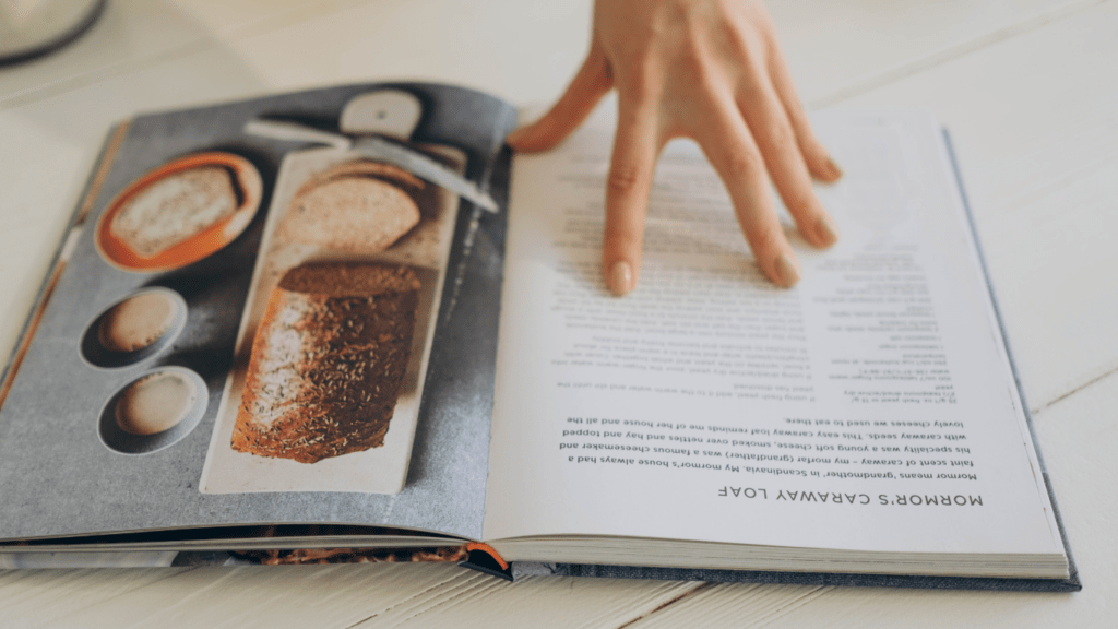 a person is holding an open book