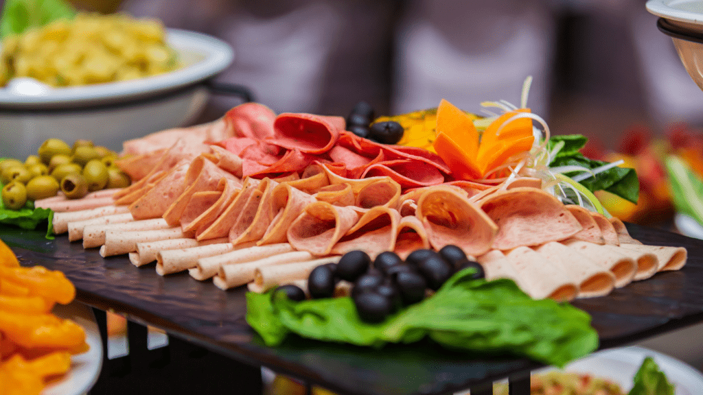 a platter of appetizers on a wooden table