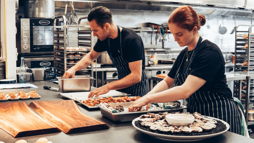 man and woman cooking