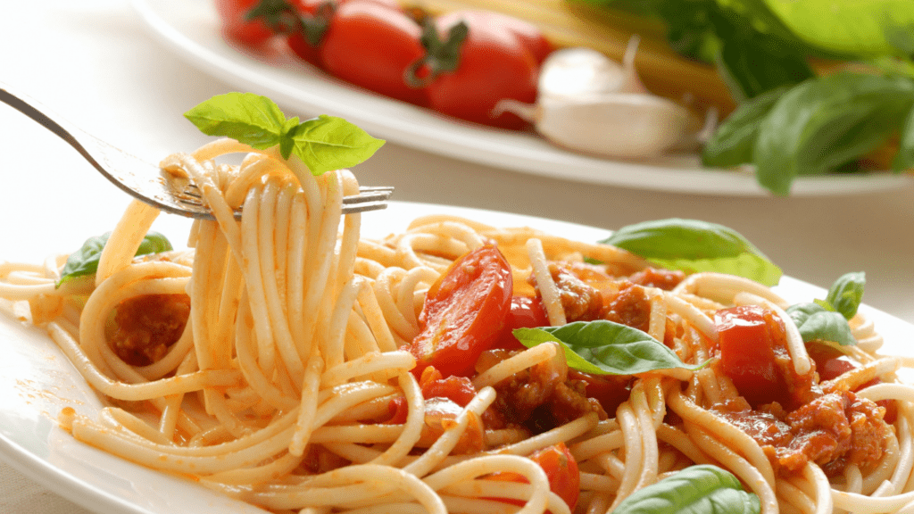 pasta with tomato sauce on a white plate