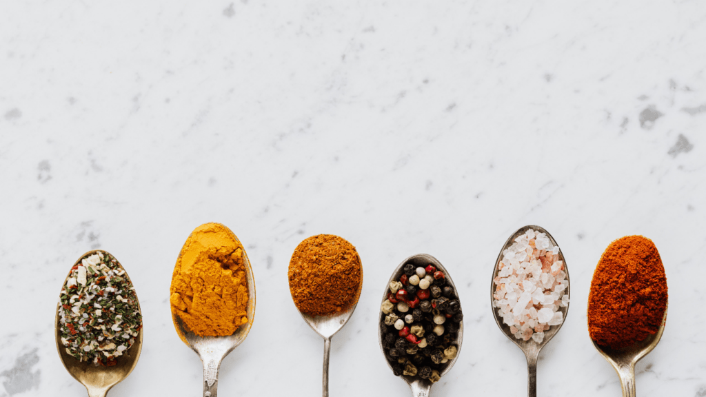 spoons with different types of spices on them